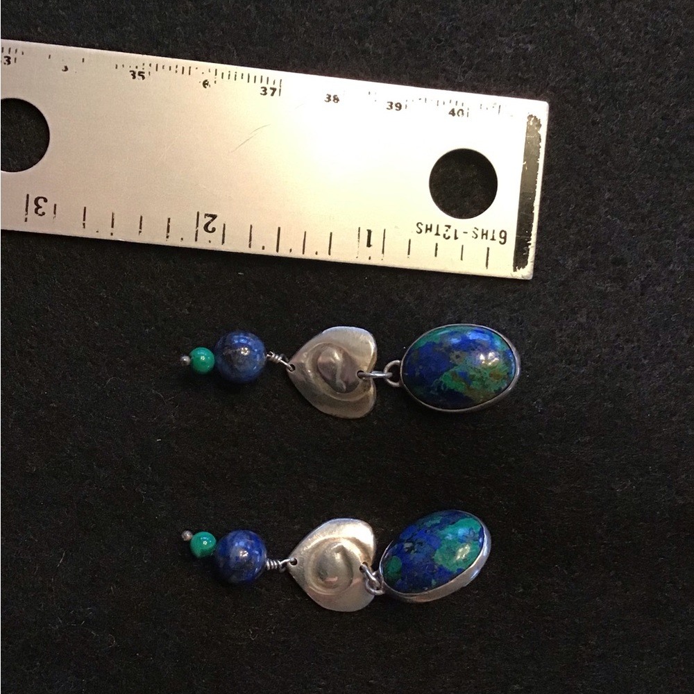 Uniquely crafted stone and silver earrings.